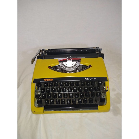 Yellow 1980s Brother Charles 11 manual typewriter